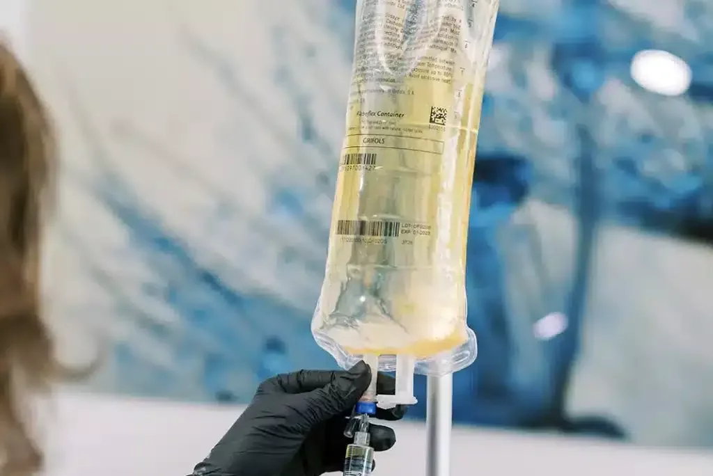 IV bag being prepared for therapy treatment.